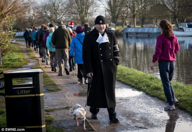 SA stroll: Mr Dutton walks with his dog, a Chinese crested hairless, in matching outfits in Cambridge