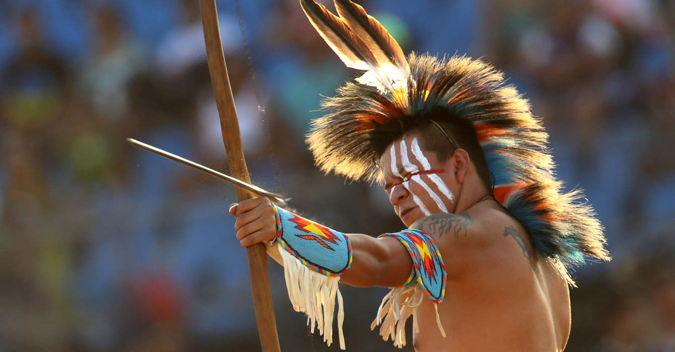 An Indian from the United States takes part in the bow and arrow competition at the World Indigenous Games, in Palmas, Brazil, Monday, Oct. 26, 2015. The event, which comes one year after Brazil played host to soccer’s World Cup and ahead of next year’s Olympics in Rio de Janeiro, kicked off on Friday. (AP Photo/Eraldo Peres)