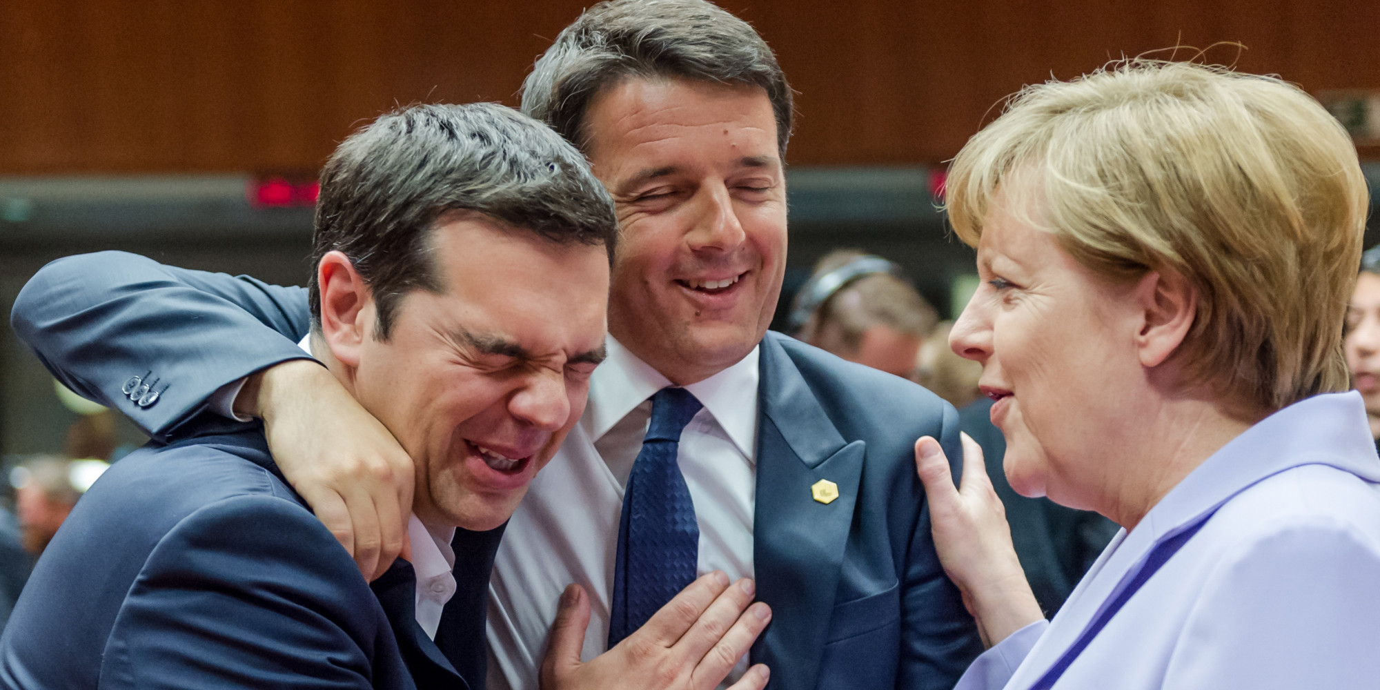 Italian Prime Minister Matteo Renzi, center, speaks with Greek Prime Minister Alexis Tsipras, left, and German Chancellor Angela Merkel during a round table meeting at an EU summit in Brussels on Thursday, June 25, 2015. Greece and its creditors launched a new round of talks in Brussels early Thursday in a fresh bid to unlock billions of euros in loans and save the country from bankruptcy. (AP Photo/Geert Vanden Wijngaert)